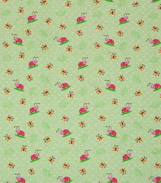 Ladybug printed fabric. There are small butterflies and pink ladybugs on a green background