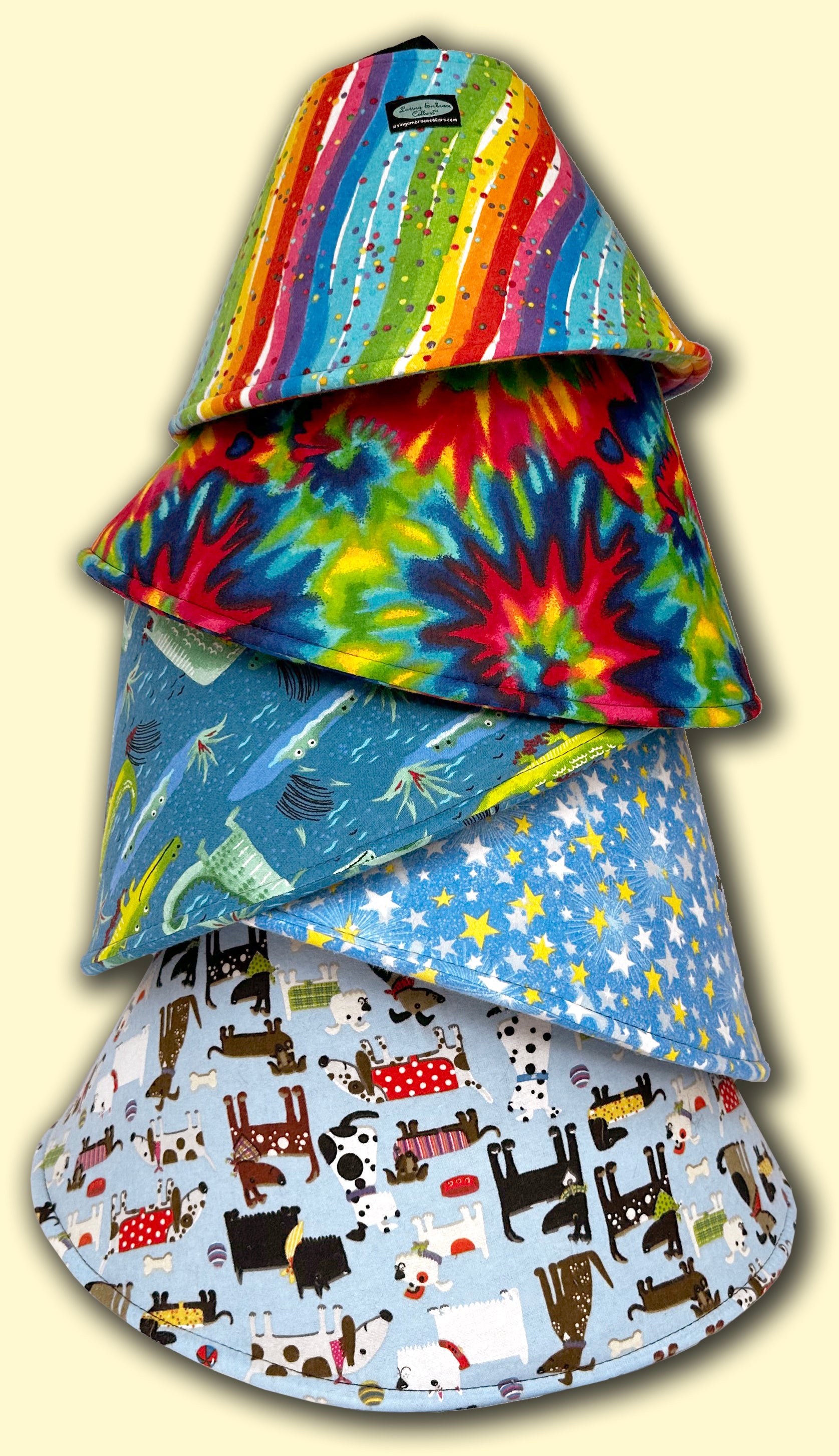 A stack of five soft cones in different bright patterned flannel fabric